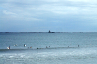 全景エボシ岩とサーフィンの写真
